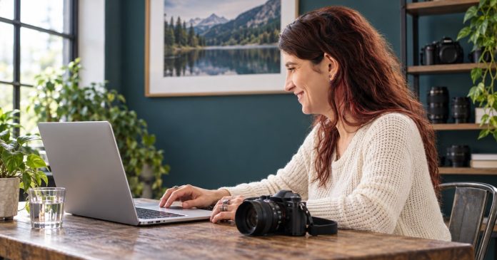 A woman checking photographs on her laptop with a camera beside her in a realistic photography workspace.